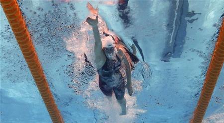 Missy Franklin of the U.S. is seen underwater as she swims in the women's 100m freestyle heats during the World Swimming Championships at the Sant Jordi arena in Barcelona August 1, 2013. REUTERS/Michael Dalder